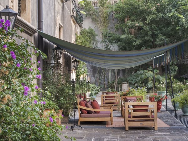 The shady sitting area outside the ground-floor bedrooms.