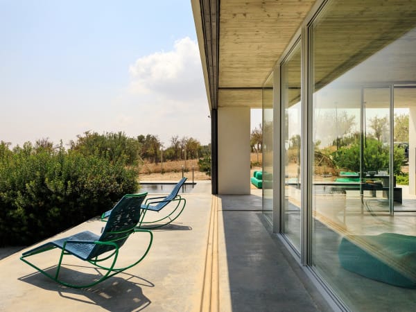 Terraces wrap around the house, offering plenty of space for guests to spread out.