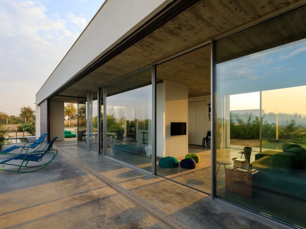 Clean lines and banks of sliding glass door hint at TerraMia's contemporary credentials.
