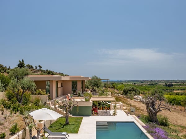 The unobtrusive contemporary lines of Tula rising above the pool.