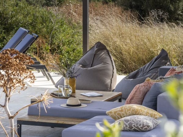 The shaded lounge area by the pool.