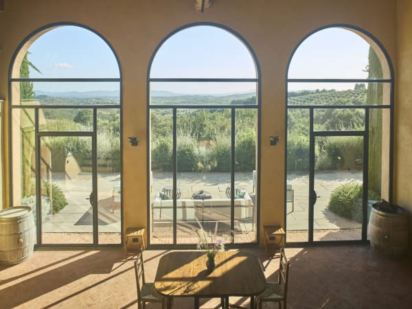 The guesthouse's voluminous "great hall" with its triptych of giant windows framing the magnificent views.