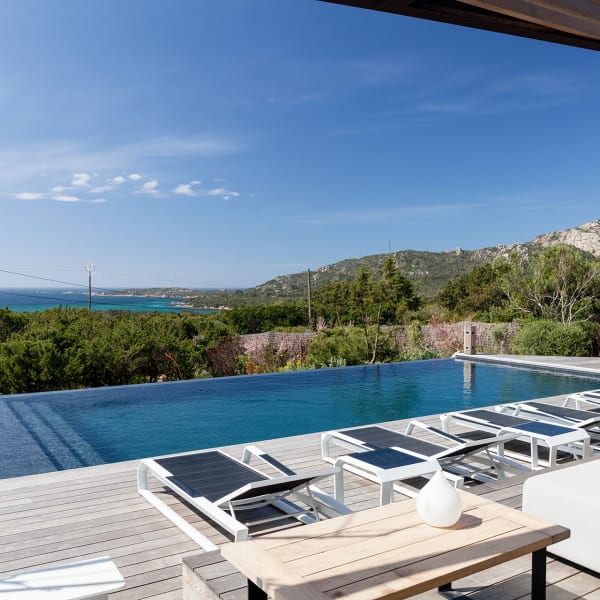 The decked terracing, the infinity pool and the sea views.