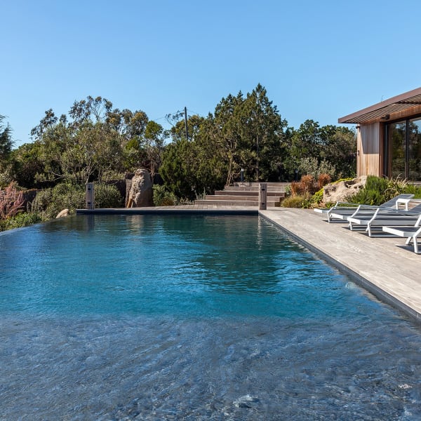 The gorgeous pool is surrounded by a large decked terrace on three sides.