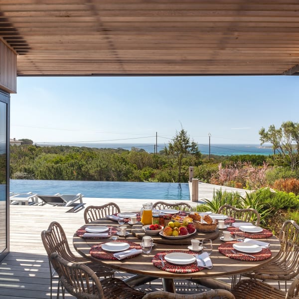 The shady outdoor dining area boasts more of those gorgeous sea views.