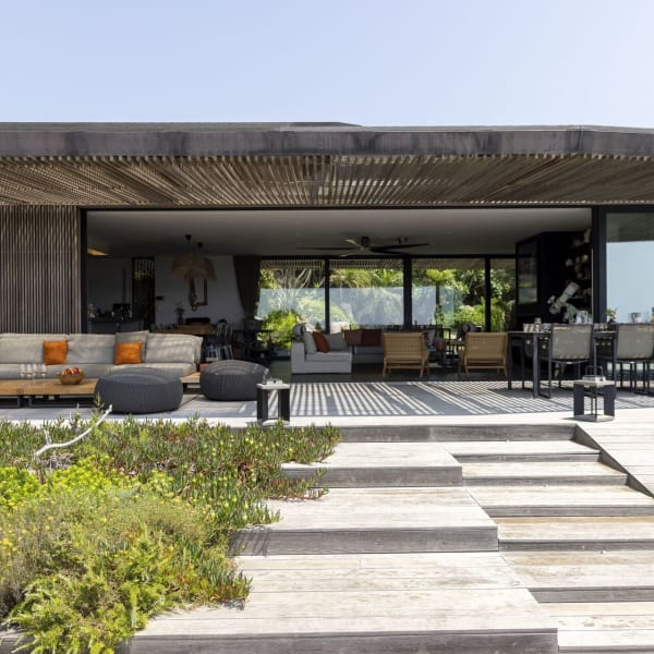 The shady al fresco living and dining area is perfect for relaxation and long, lazy meals.