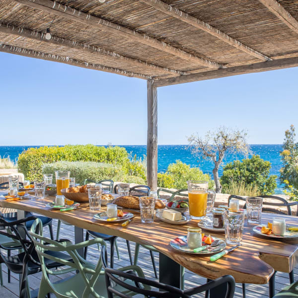 The long shaded sea-view terrace is the perfect spot for long convivial meals.