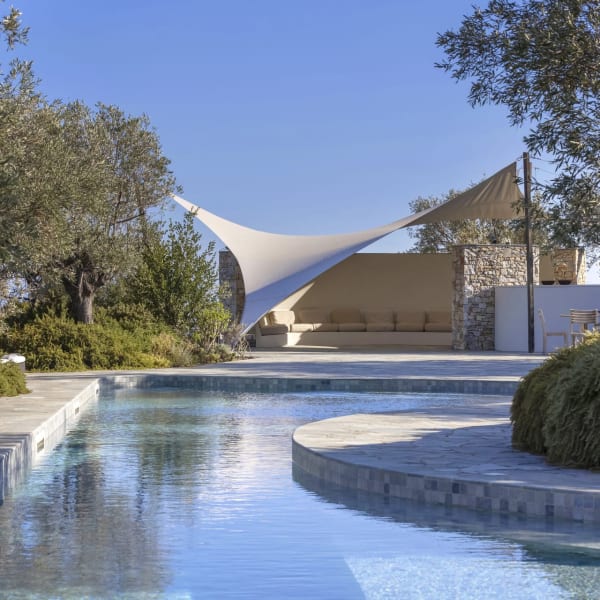 Relaxing down by Adelphia's extraordinary, 25m-long pool.