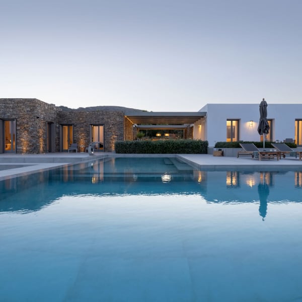 The main house (on the right) and the guesthouse (on the left) are separated by a series of well-shaded al fresco areas.