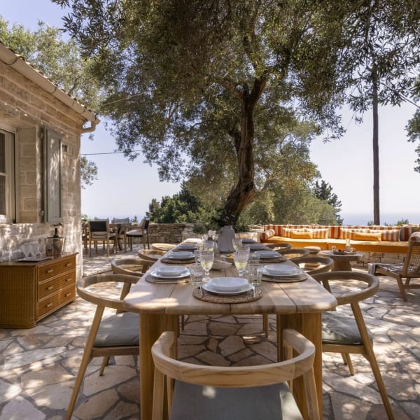 The shady al fresco dining area with the sea on the horizon.