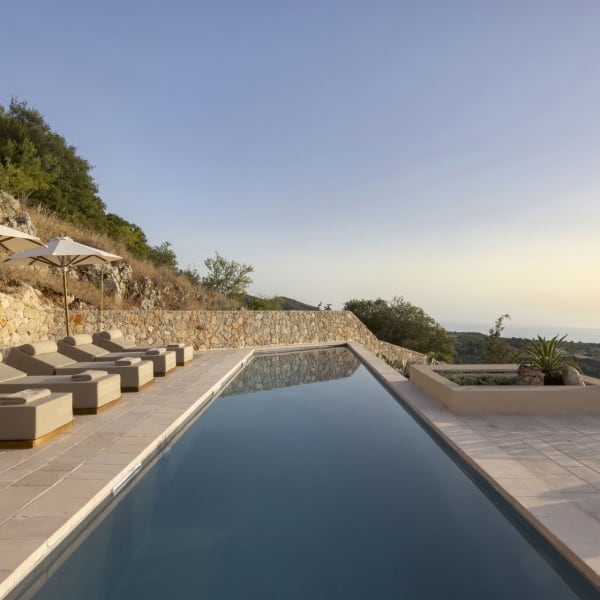 The elegant pool is flanked by quality loungers.