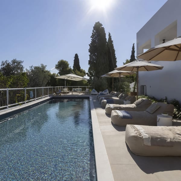 Relaxing by Catrine's enticing pool.