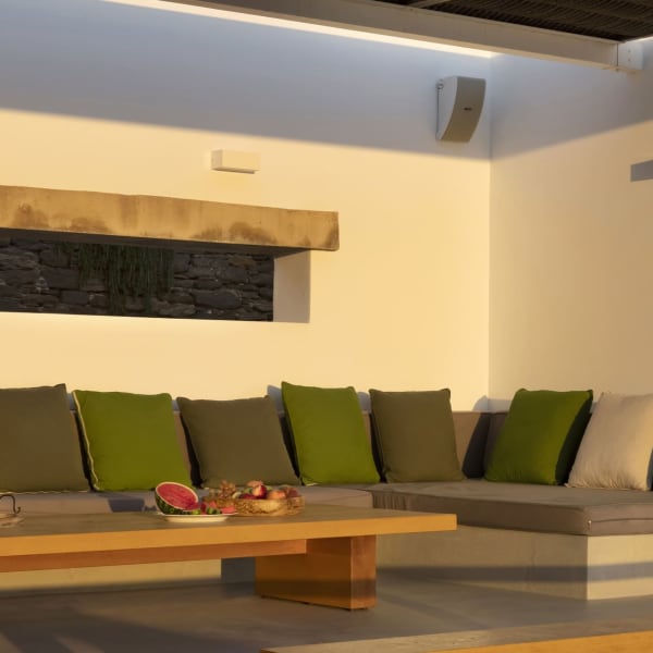 The shady al fresco living area with its cushioned, in-built seating.