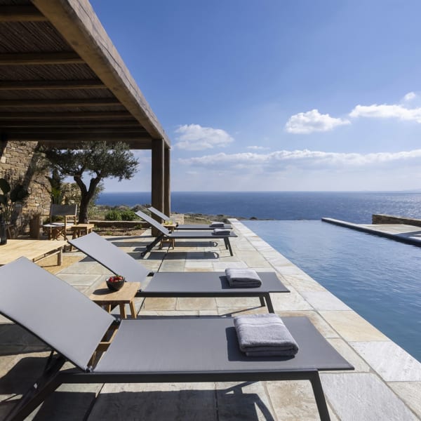 Enyalos's sleek infinity pool appears to merge with the sea.