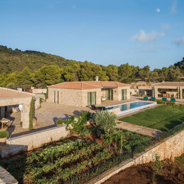 Estrella, its pool, gardens and terraces bathed in soft, late afternoon sunlight.