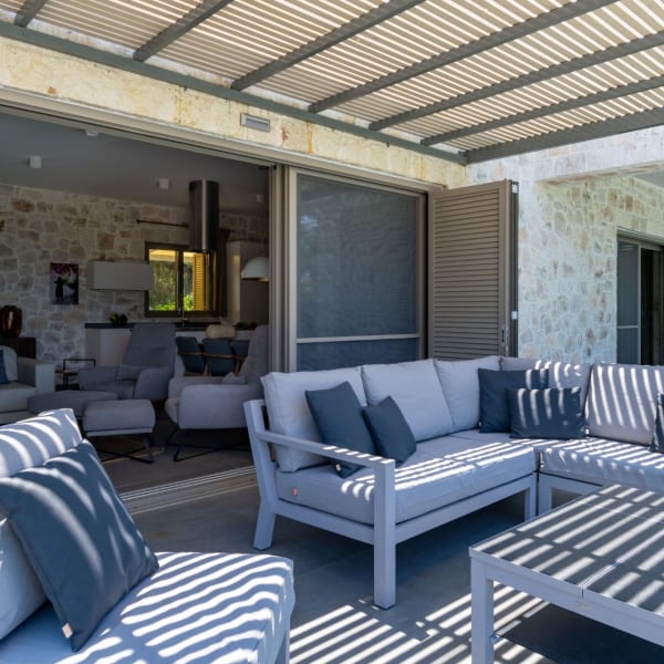 The main ground floor terrace is home to a comfortably furnished sitting area.