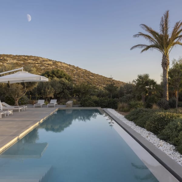 Marike's tempting pool is flanked by terraces and fragrant greenery.