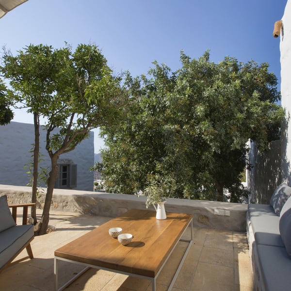 A sitting area on the sheltered, walled terrace outside the kitchen.