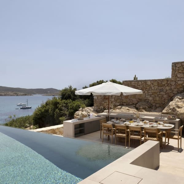 The secluded al fresco dining area and kitchen seen from the pool terrace.