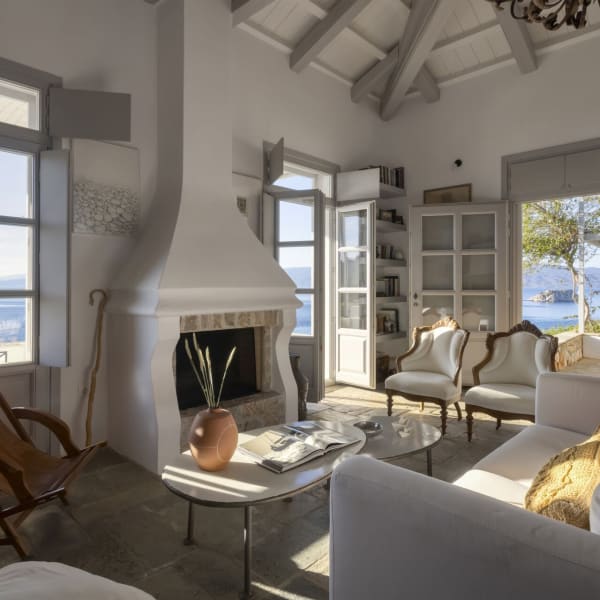 The luminous open-concept communal area on the top floor looks out to sea via a pair of French doors.