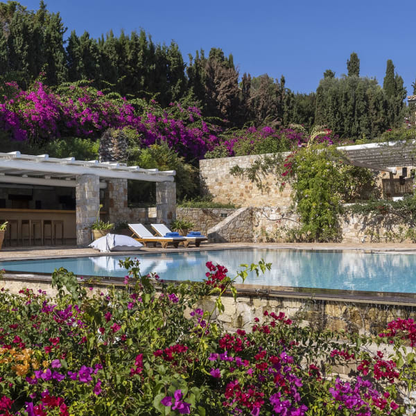 Vibrantly colourful flowers and emerald greenery cocoon the property in an atmosphere of fragrant tranquillity.