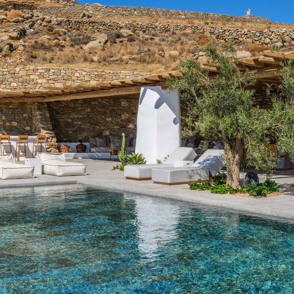 Back by the inviting blue-hued waters of the pool.