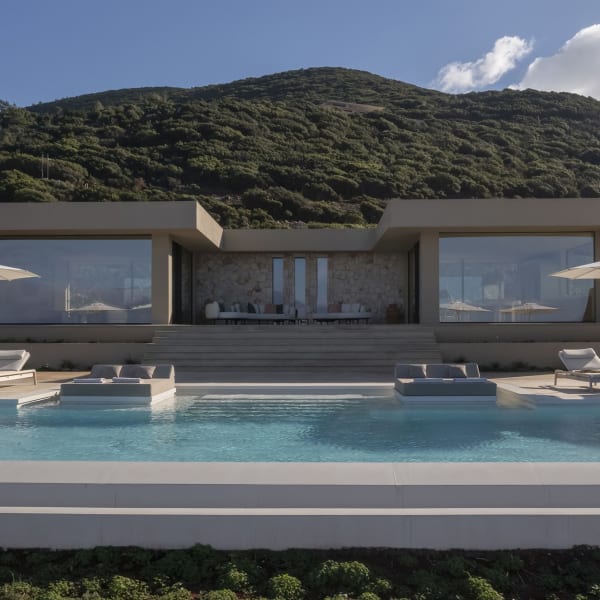 Villa Meraki's handsome façade rising above the gorgeous pool.