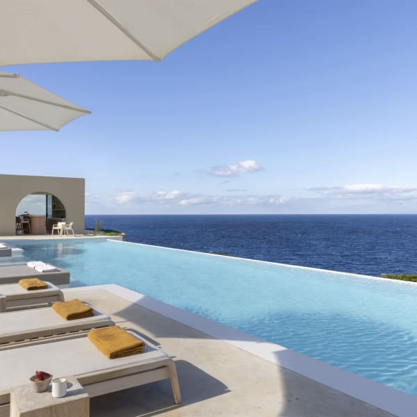 Stylish poolside living at Villa Meraki. You will never tire of those views.