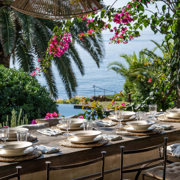 Shady outdoor dining with a sea view. 