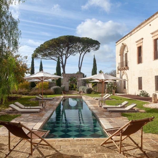 The splendid pool area and gardens at Casino Doxi Stracca with the palazzo on the right.