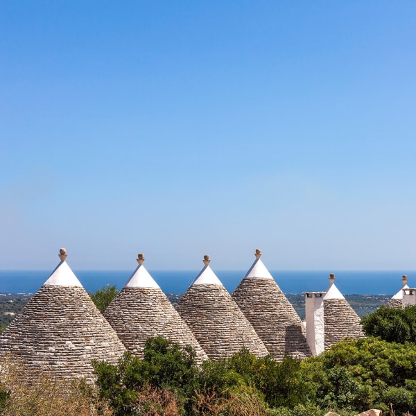 The trulli are surrounded by beautifully-tended gardens and lawns.