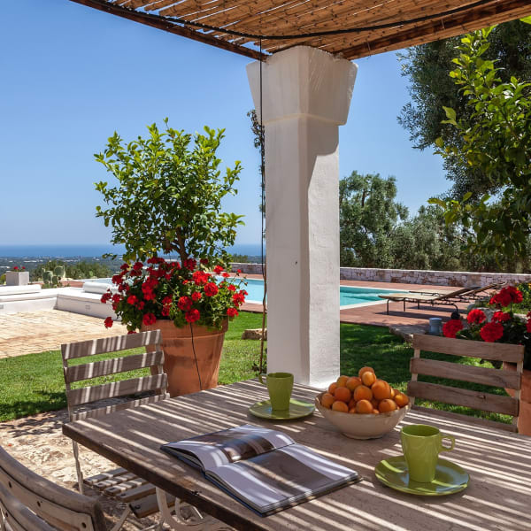 The shaded al fresco dining area overlooking the pool.