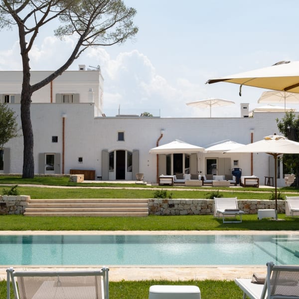 Verdant lawns, cerulean waters and the pristine white façade of Masseria Ciasca.