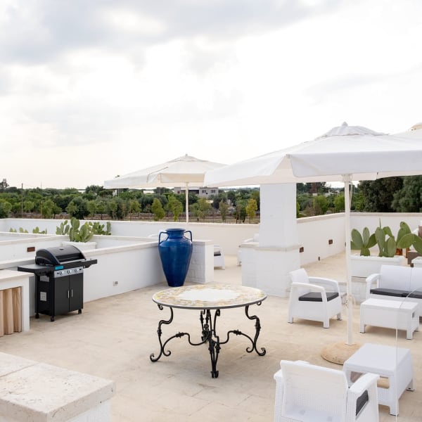 The fabulous roof terrace has lots of different areas, including a kitchen.