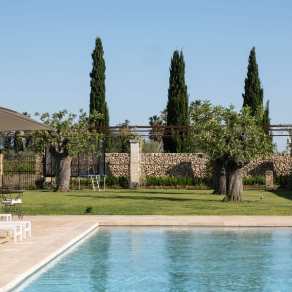 Manicured emerald lawns, venerable olive trees and stone walls provide a backdrop to your holiday.