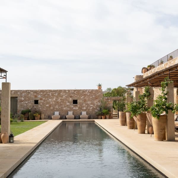 The fabulous pool is flanked by shady sitting areas.