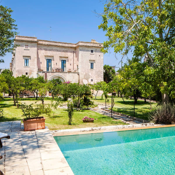 The handsome facade of Palazzo Colucci seen from the pool.