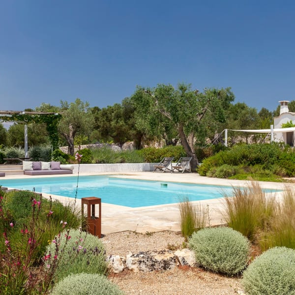 The pool, gardens and trulli.