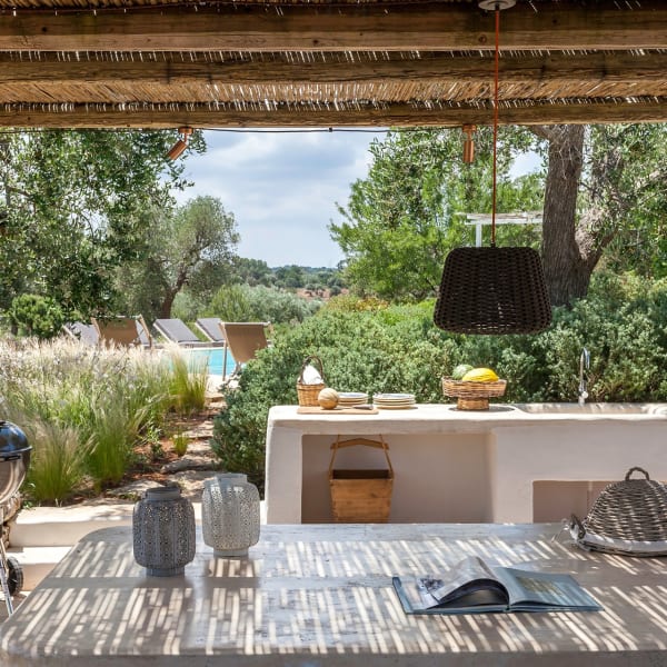 The shaded al fresco dining area near the pool.