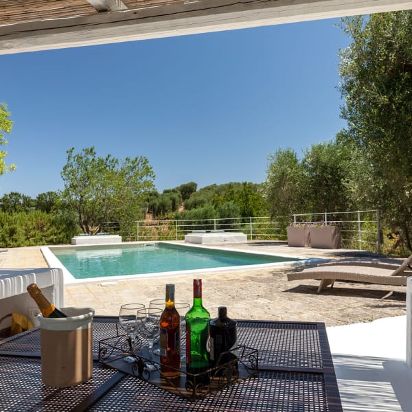 The shaded lounge area next to the pool.