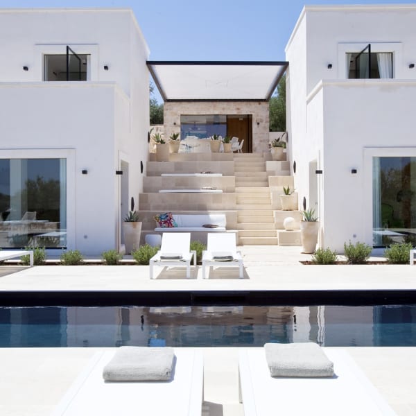 The French windows on the left access the living room, those on the right a bedroom.