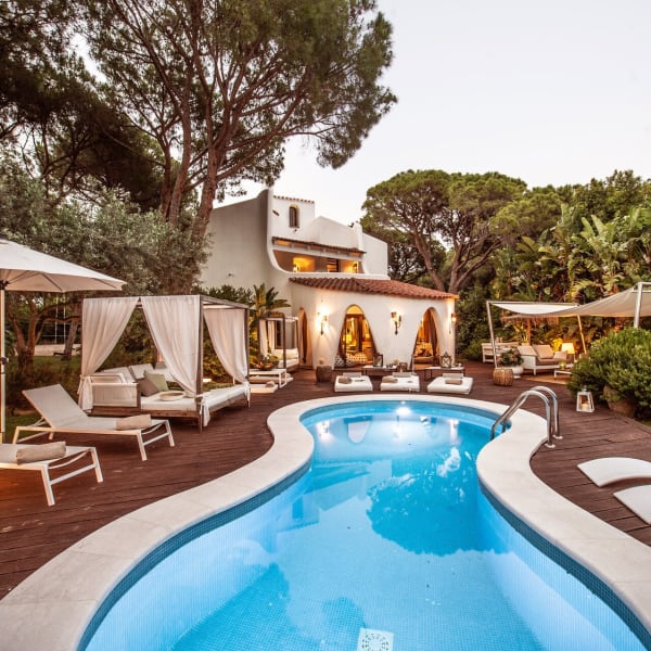 Maria's tempting figure-of-eight pool, surrounded by decking and sun loungers.