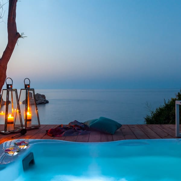A magical crepuscular atmosphere by Ai Faraglioni's Jacuzzi.