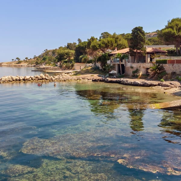 The limpid, serene waters of the Ionian Sea are just a few steps away.