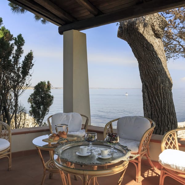 The shaded al fresco living area to one side of the house.
