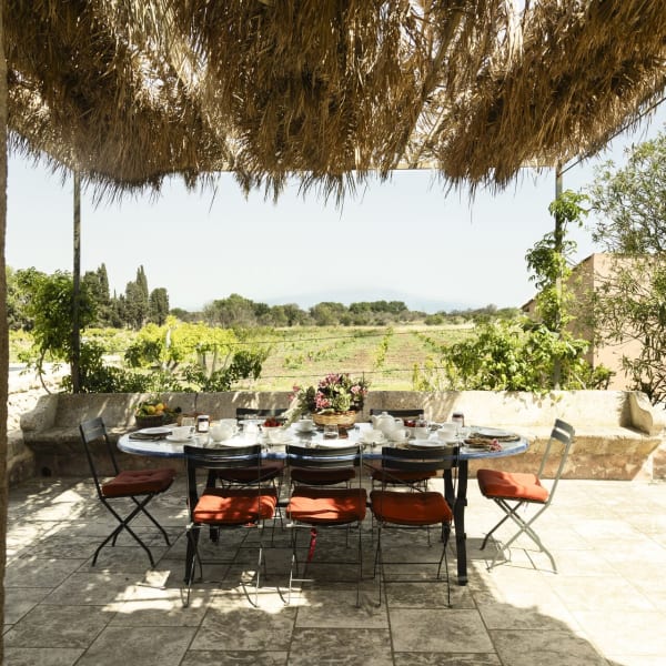 Arbolì's shady al fresco dining area seen from the kitchen. 