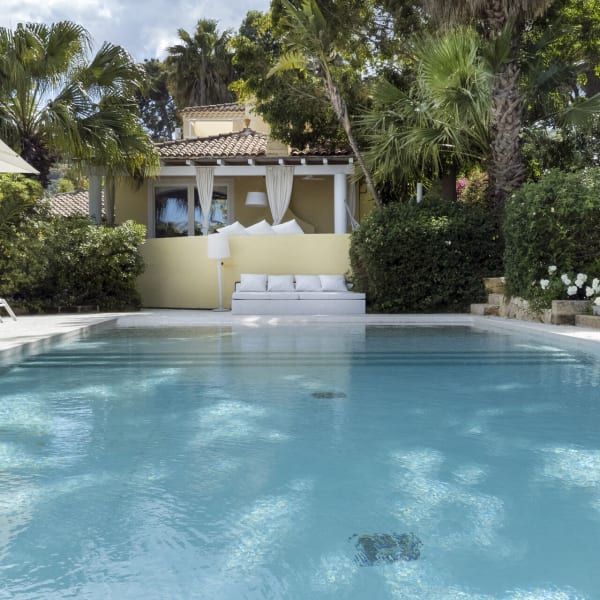 The pool with the house behind.