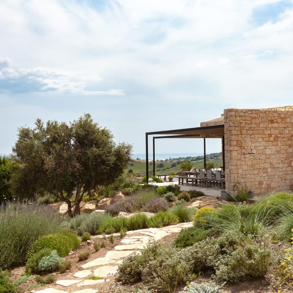 Paths weave through the fragrant gardens, linking the various areas.