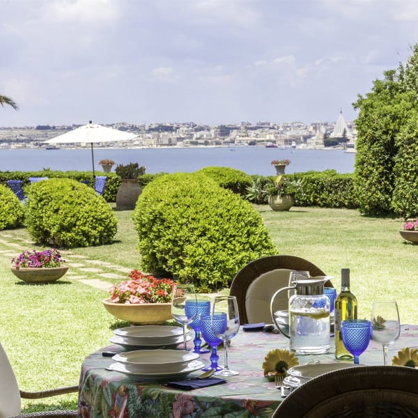 Dining on the shady terrace outside the living area.
