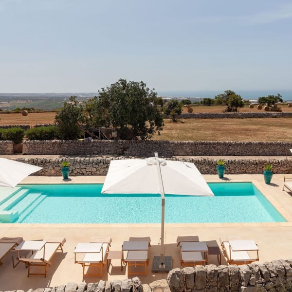 The irresistible pool and views out across the rolling farmland to the sea.